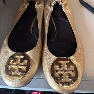 Metallic gold Tory Burch slide on flats